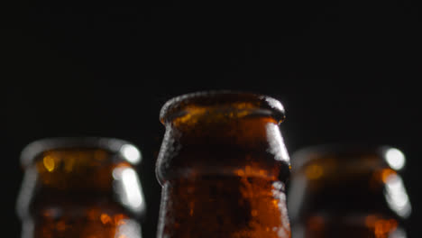 Close-Up-Of-Condensation-Droplets-On-Neck-Of-Bottles-Of-Cold-Beer-Or-Soft-Drinks-With-Water-Vapour-After-Opening
